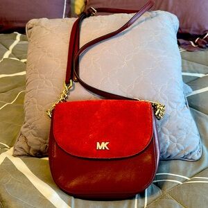 Michael Kors oxblood saddle bag. Suede and leather. Used but great condition.